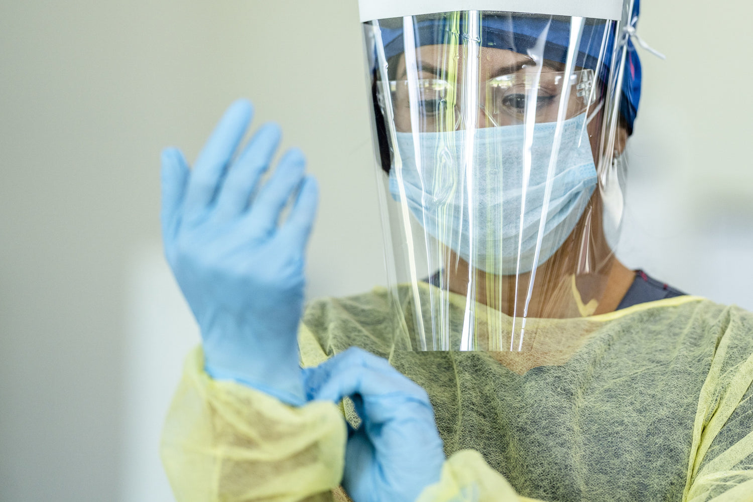 Nurse putting on autralian made medical PPE manufactured by Adarsh Medical